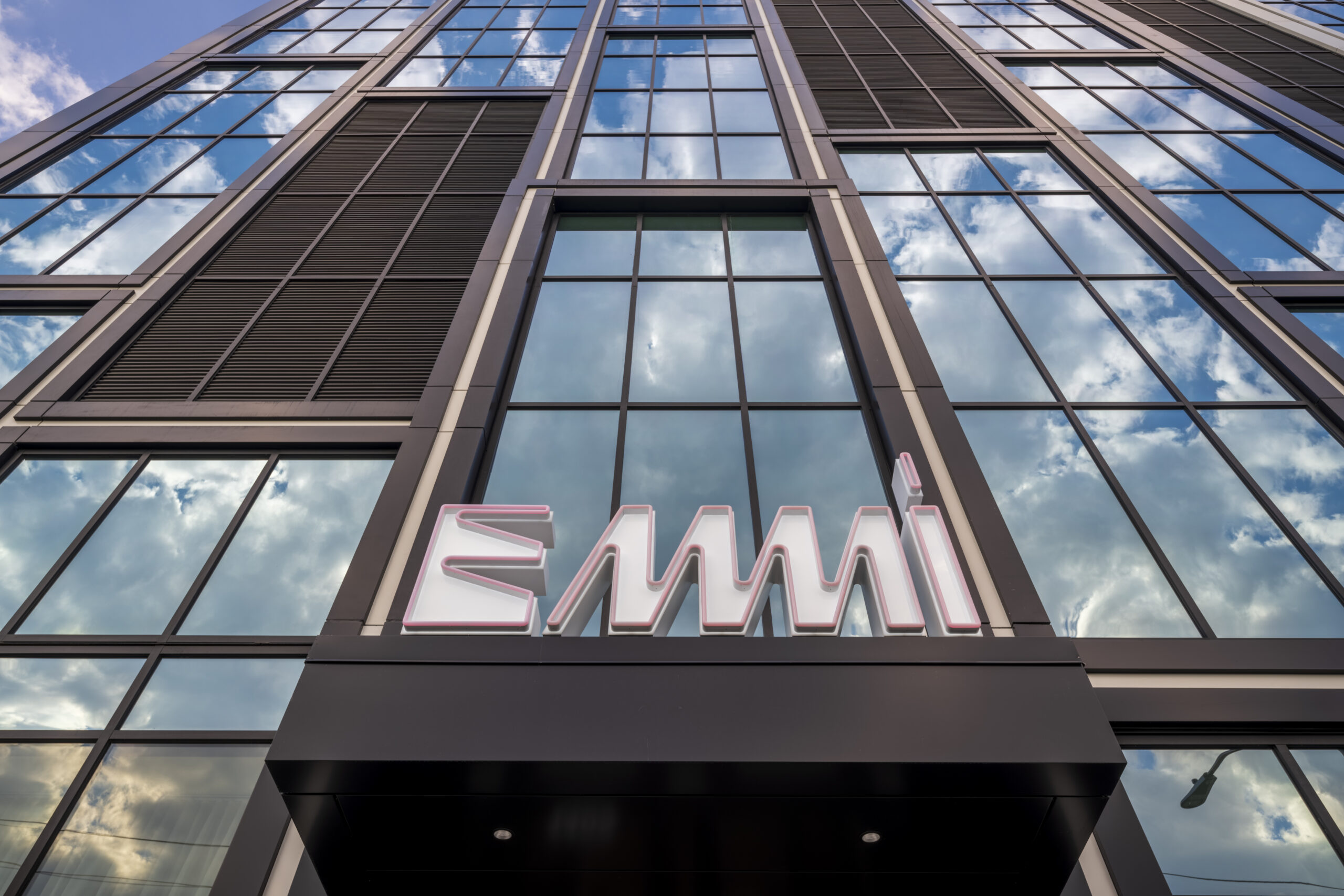 GSI-installed curtainwall rising over the Emmi Midtown entrance